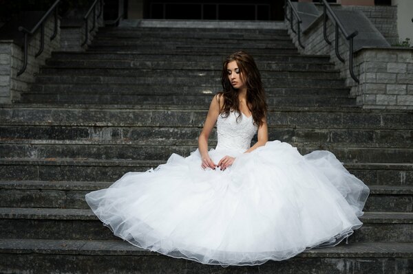 The bride on the gloomy staircase