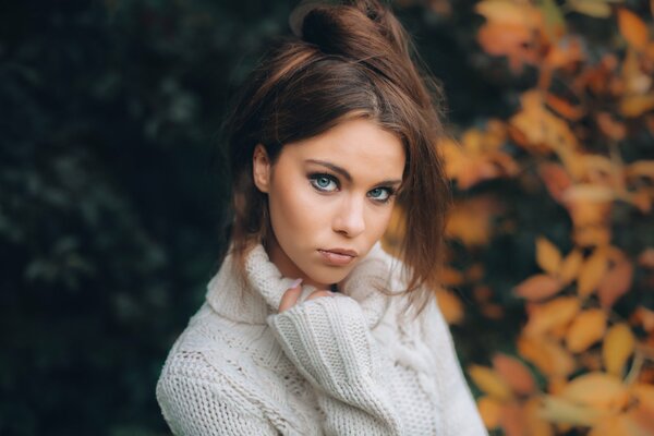 Photo of a beautiful girl in an autumn sweater