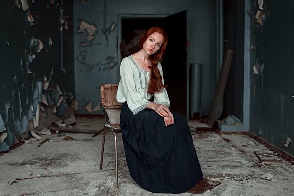 Oksana Butovskaya in the destroyed room