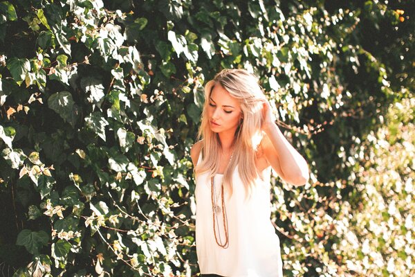 Lauren York on a background of green plants