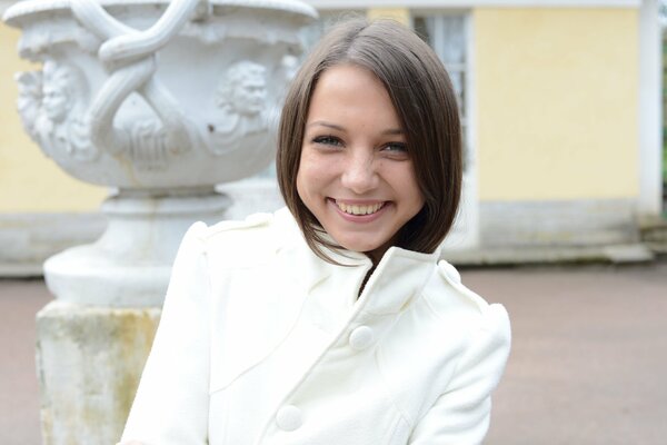 Brunette girl smiling on the street