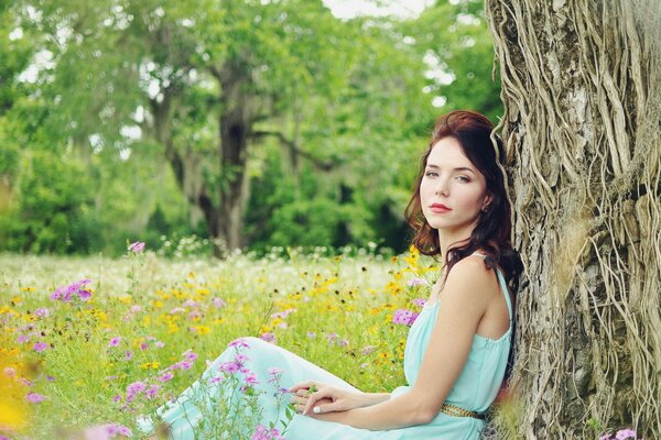 Beautiful girl in a flower field