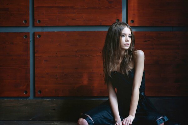 Slender girl posing in a dress