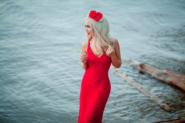 Charming blonde in a red dress