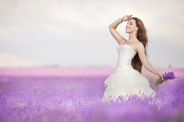 Bride in a field with lavender flowers