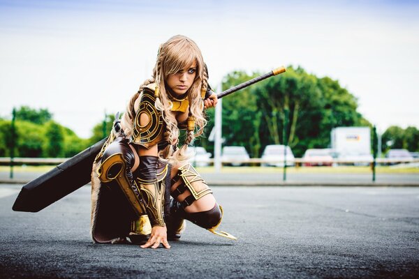 A girl in armor with a sword from guild wars