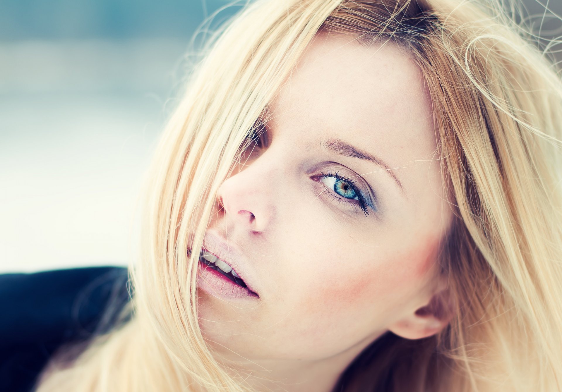 blonde hair face. view eyes lips model close up