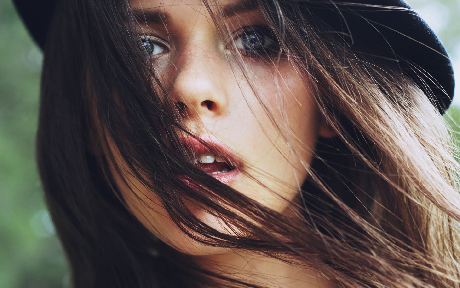 brunette face eyes hair wind mood