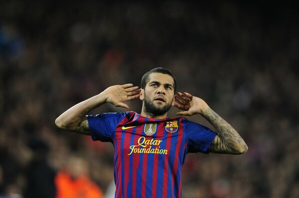 Barcelona footballer Dani Alves joy after the game