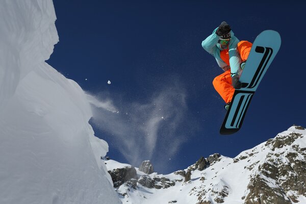 Snowboarder in the mountains. Mountains. Snow