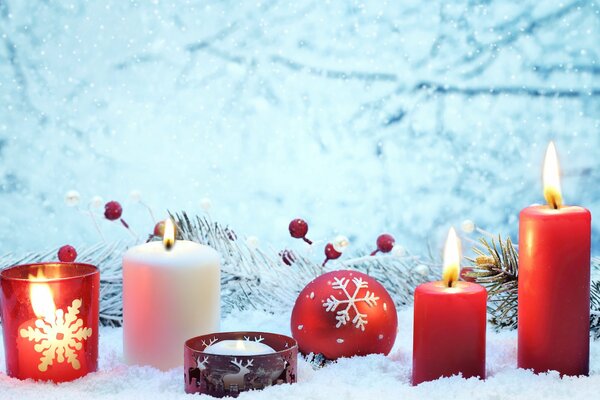 Christmas and New Year decor in the form of candles and balloons on a white background