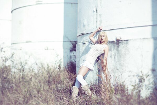 Photo of a blonde girl in a white dress