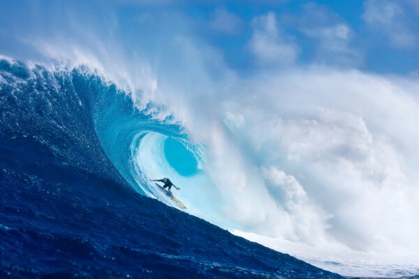 Surfer on the waves in the ocean