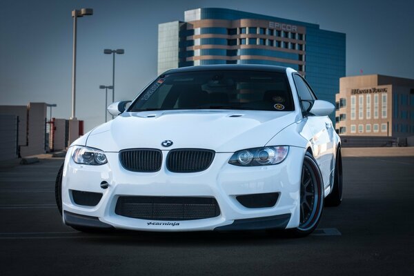 White BMW car in the parking lot