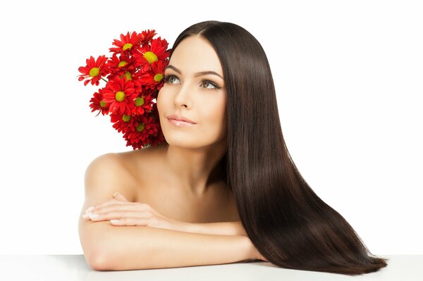 Brown-haired woman with long hair on a white background