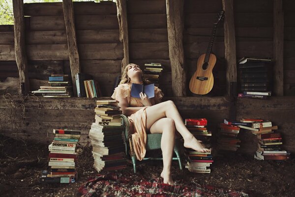 Barefoot girl reading a book