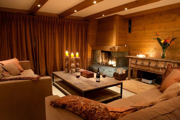 A room with wooden trim and a large fireplace