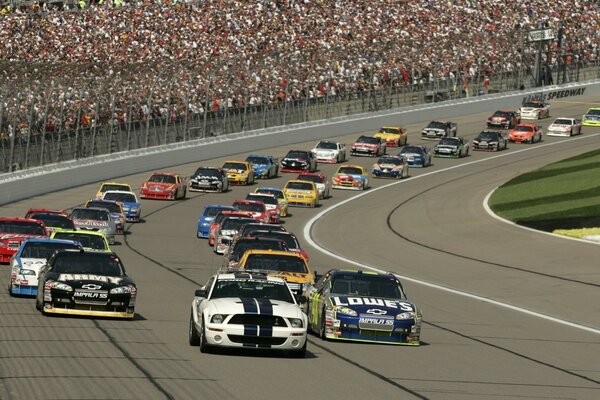 Car racing against the background of the audience