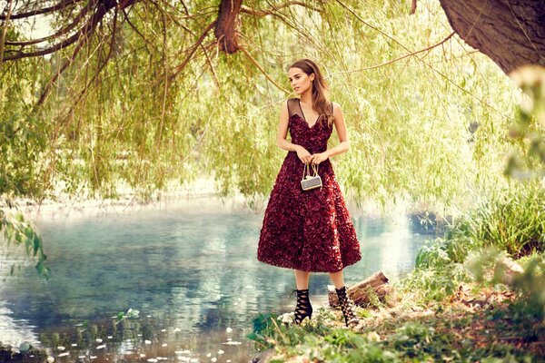 The girl in red by the lake