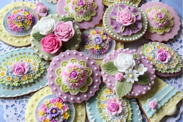 Cookies painted with multicolored glaze on an openwork napkin