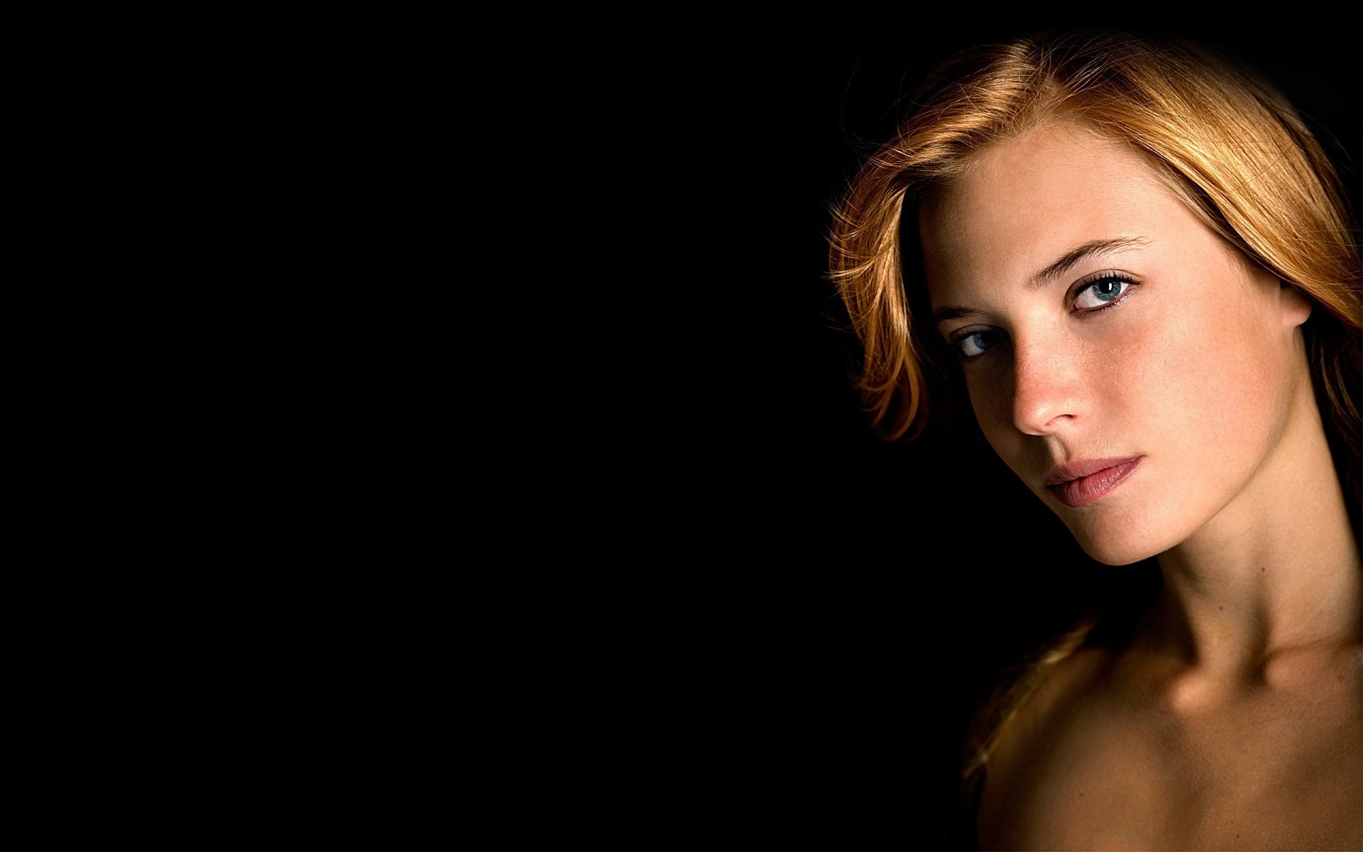 blonde face portrait hair eyes . dark background