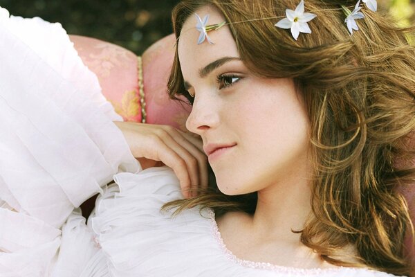 A girl with white flowers in her hair