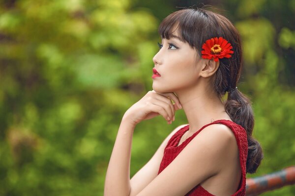 Asian girl with a flower in her hair