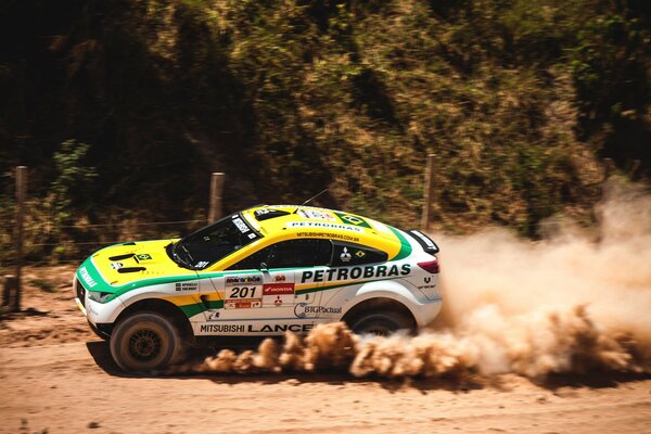 Mitsubishi rides on a dusty road