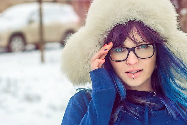 Girl with piercing , blue eyes