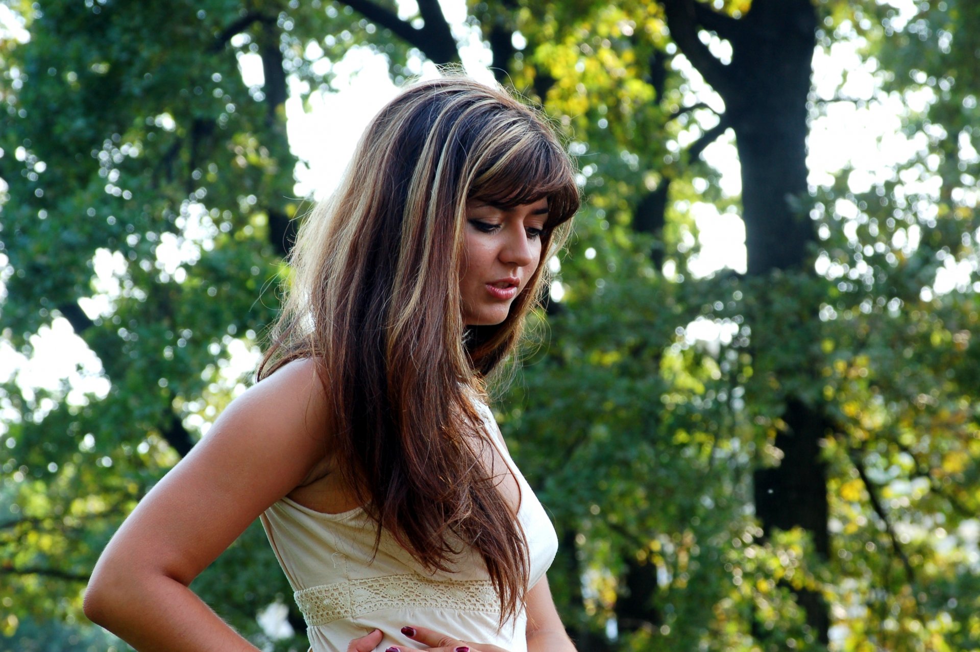 girl face hair eyes pensive look forest tree blur