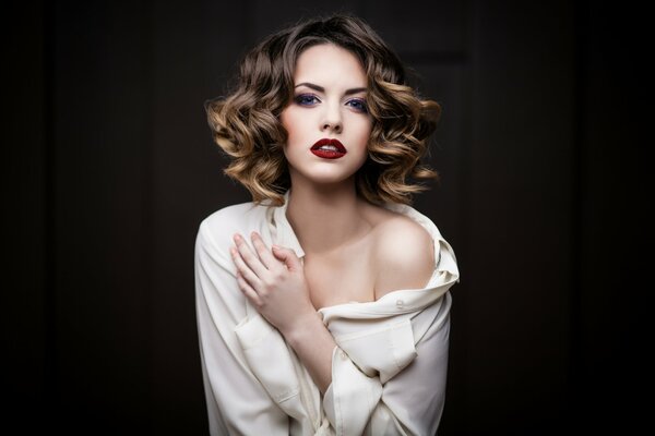 Model girl with bright makeup in a shirt