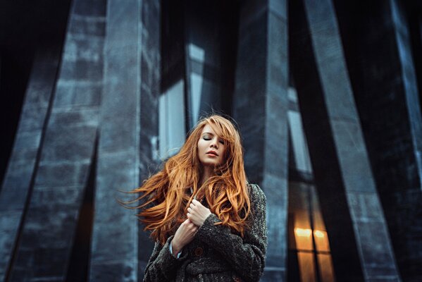 Red-haired girl in a dark throat