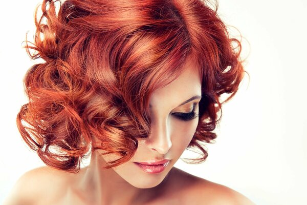 A girl with red hair on a white background