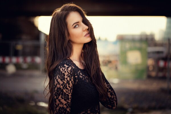 Profile of a girl in a lace dress