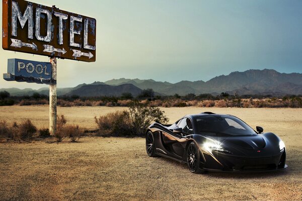 The headlights of a supercar in the desert