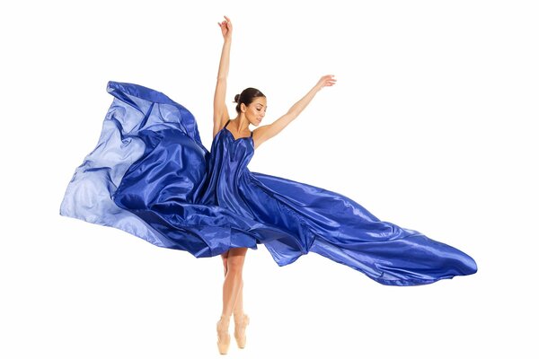 A girl in a blue dress dancing