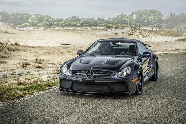 A sporty black car on the road