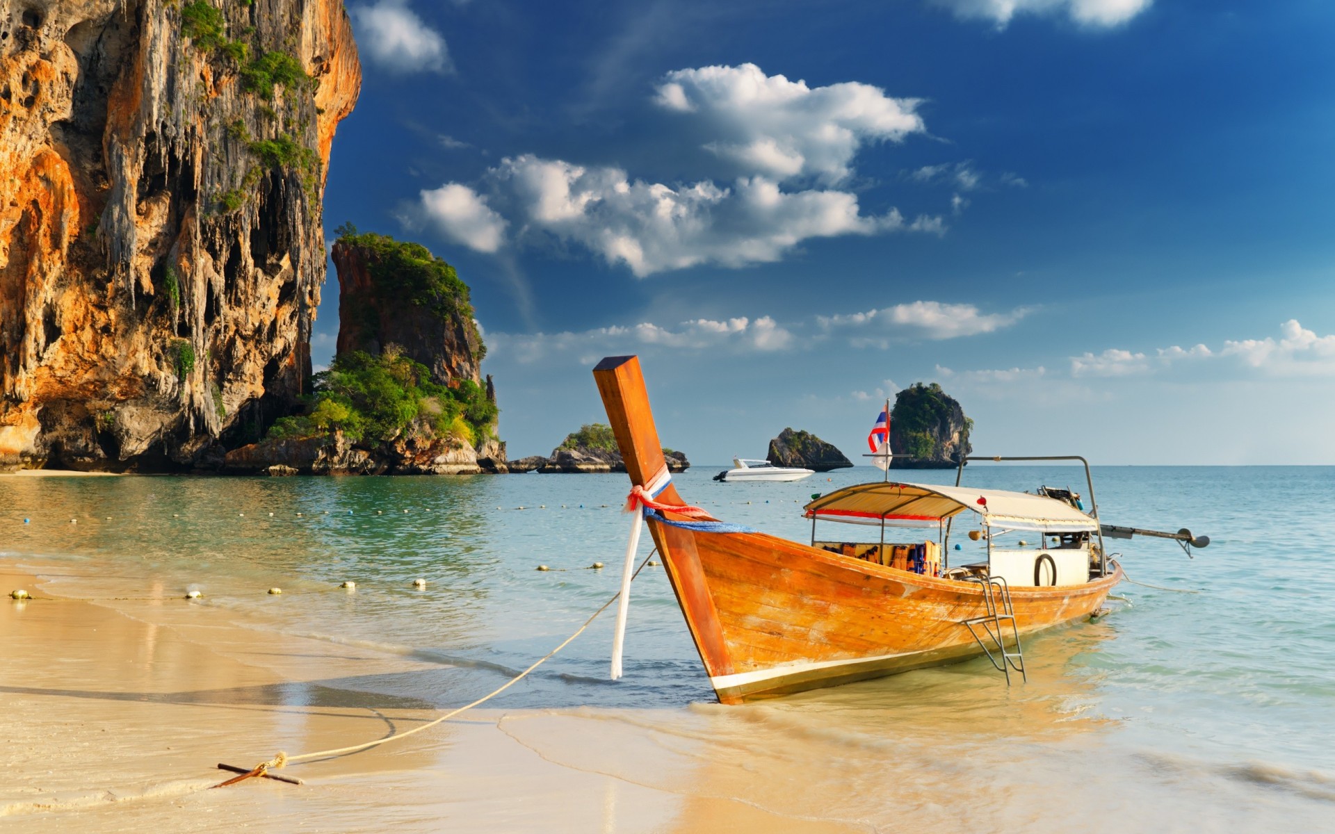 beach clouds sea rock sand boat