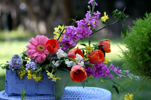 Beautiful bouquet with tulips in a basket