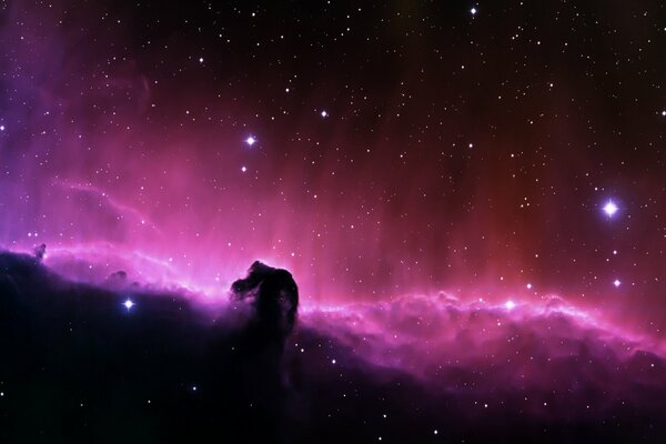 Purple outer space with nebulae