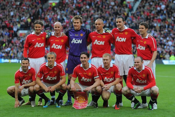 En la foto, los Campeones son los futbolistas del Manchester United