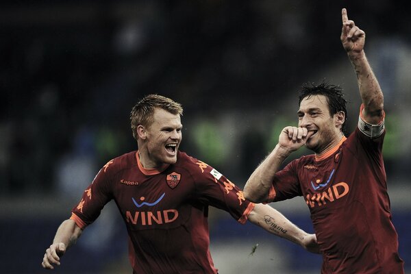 Jugadores de fútbol Roma y Totti durante el juego