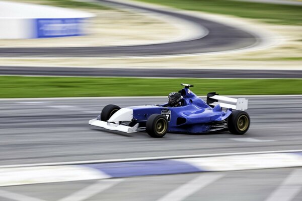 Blue racing car during a Formula 1 race