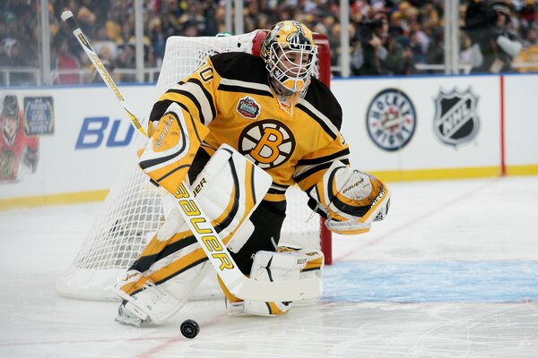 Hockey Goalkeeper in yellow and white uniform