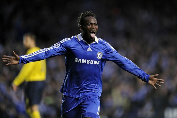 A football player in a blue uniform with the inscription Samsung runs across the field