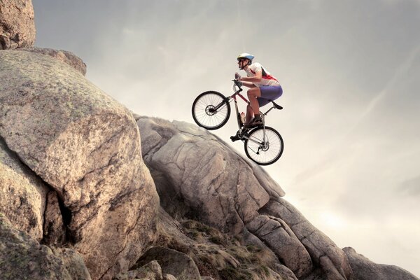 He climbs the mountain by bike