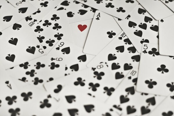 A deck of cards scattered on the table