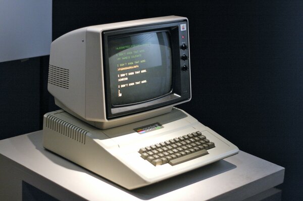 An old mac computer is on the table