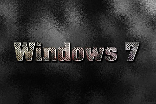 Immagine per il risparmiatore di Windows 7 a grandi lettere nel mezzo su sfondo scuro