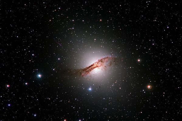 A distant bright galaxy against the background of stars